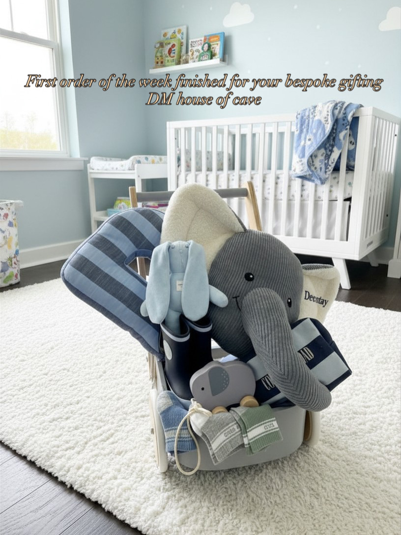 Bespoke blue keepsake cart styled with a grey elephant, blue bunny, blanket and gumboots